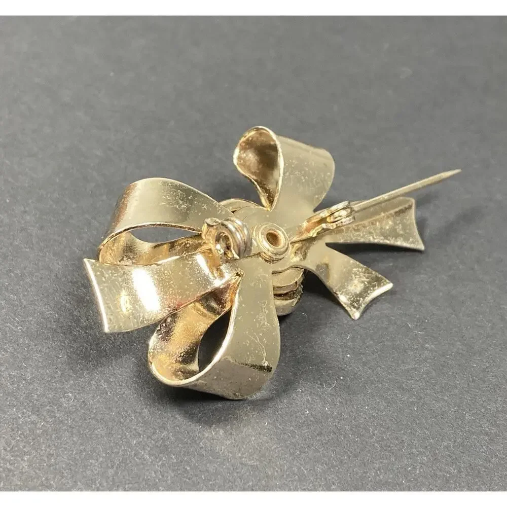 Vintage Coro Flower and Bow Brooch Gold Tone Clear Crystal Center Signed